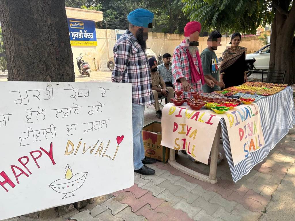 Deaddiction centre patients prepare Diyas setup sale counter outside Nasha Mukti Kendra